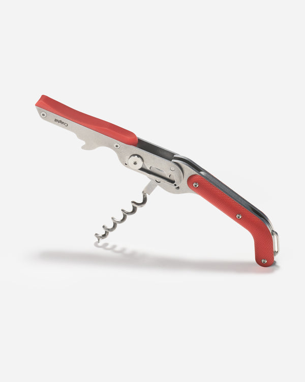 Red and silver corkscrew on a white background