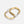 Gold and silver hoop carabiner on a white background