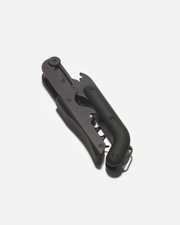 Black wine opener on a white background