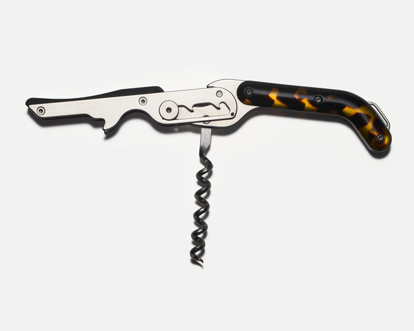 Wine opener with tortoiseshell handle on a white background