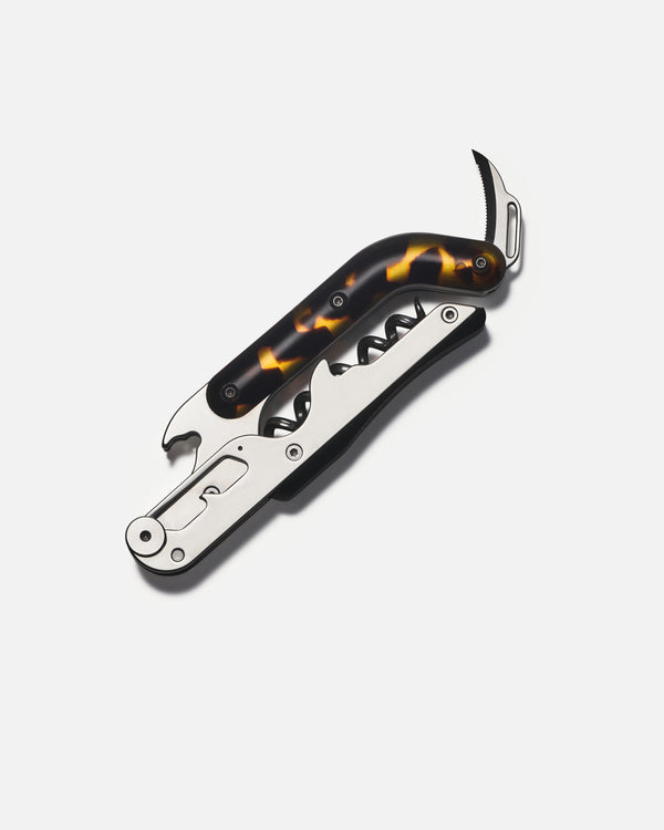 wine opener with tortoiseshell handle on a white background