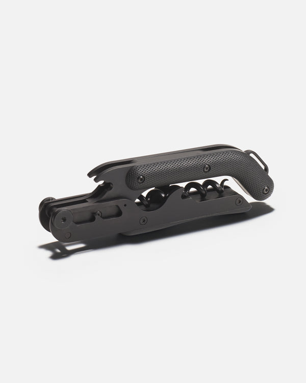 Black wine opener on a white background