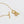 Gold necklace with a pendant on a white background