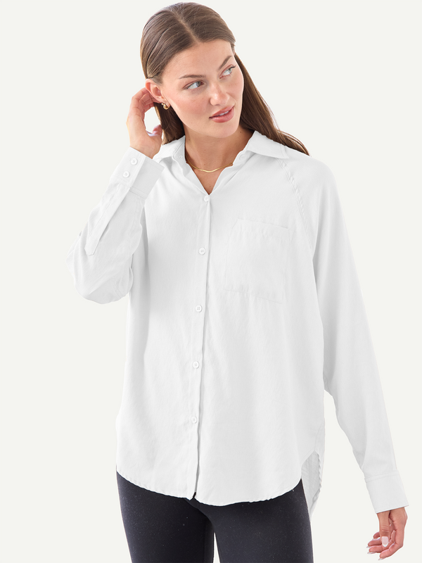 Woman wearing a white shirt on a white background