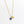 Gold necklace with a blue pendant on a white background